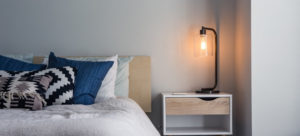 Bed, bedside table and lamp