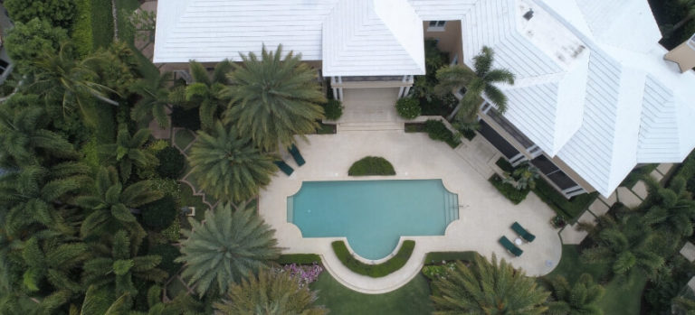 Aerial view of large house and pool