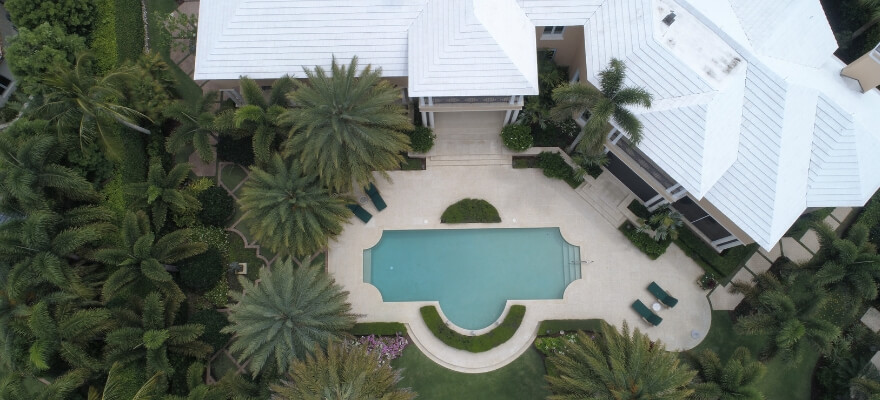 Aerial view of large house and pool